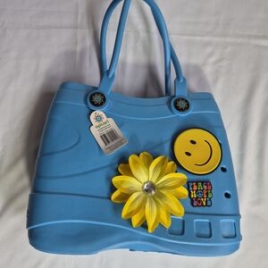 Optari Sol Tote, a waterproof handbag crafted from soft, durable rubber